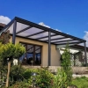 Przezroczyste zadaszenie tarasu 6,06 x 3,50 m – ochrona przestrzeni wypoczynkowej przed opadami i UV